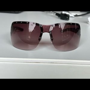 Purple womens Gucci sunglasses.